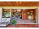 Spacious living room as seen from a screened in porch, features hardwood accents at 724 69Th S Ave, St Petersburg, FL 33705