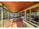 Covered screened in porch with tile flooring and outdoor dining furniture at 724 69Th S Ave, St Petersburg, FL 33705