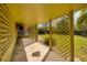 Covered porch features lattice detail, decorative plants, and a lush yard at 724 69Th S Ave, St Petersburg, FL 33705
