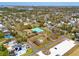 An aerial shot showcases the residential neighborhood amenities, including a nearby recreational center, with the property highlighted at 7415 S Obrien St, Tampa, FL 33616