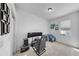 Spacious bedroom with natural light, gaming setup, and plush carpeting at 8220 Round Leaf Ln, Riverview, FL 33578