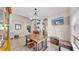 A naturally lit dining room featuring a large table and tiled floors at 8220 Round Leaf Ln, Riverview, FL 33578