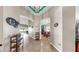 Hallway featuring tile floors that connect kitchen, dining, and living areas at 8220 Round Leaf Ln, Riverview, FL 33578