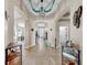 Tiled hallway showcasing the house's open floor plan and decor at 8220 Round Leaf Ln, Riverview, FL 33578