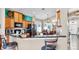 Open concept kitchen featuring granite counters and black stainless steel appliances at 8220 Round Leaf Ln, Riverview, FL 33578