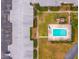 An aerial view of the condo complex buildings and community pool at 8303 Bardmoor Blvd # 105, Seminole, FL 33777