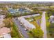 An aerial view of the condo complex and community amenities including pool and tennis courts at 8303 Bardmoor Blvd # 105, Seminole, FL 33777