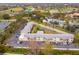 This is an aerial view of a condo complex that features a community pool and ample parking at 8303 Bardmoor Blvd # 105, Seminole, FL 33777