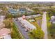 This is an aerial view of a condo complex with parking and common areas conveniently located close to tennis courts at 8303 Bardmoor Blvd # 105, Seminole, FL 33777
