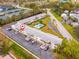 Aerial view of condo complex with parking, common areas, and convenient access to nearby tennis courts at 8303 Bardmoor Blvd # 105, Seminole, FL 33777