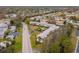 Scenic aerial view of condo complex featuring manicured lawns and lush surrounding foliage at 8303 Bardmoor Blvd # 105, Seminole, FL 33777