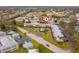Aerial view of an apartment community with a pool, parking, and mature trees at 8303 Bardmoor Blvd # 105, Seminole, FL 33777