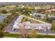This is an aerial view of a condo complex that features a community pool and ample parking at 8303 Bardmoor Blvd # 105, Seminole, FL 33777