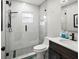 Updated bathroom with glass enclosed shower, stone floor and modern sink at 8303 Bardmoor Blvd # 105, Seminole, FL 33777