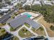 An aerial view of the community center showcasing the pool and surrounding landscaping at 9790 66Th N St # 469, Pinellas Park, FL 33782