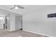 Bright bedroom with neutral walls, carpet, and a mounted TV, showcasing a clean and simple design at 9790 66Th N St # 469, Pinellas Park, FL 33782
