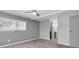 Calm bedroom with ceiling fan, natural light from the window, and neutral-colored walls and carpet at 9790 66Th N St # 469, Pinellas Park, FL 33782