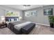 Comfortable bedroom with large windows, soft carpet, and a neatly made bed with pillows at 9790 66Th N St # 469, Pinellas Park, FL 33782