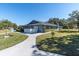 Exterior of community clubhouse with well maintained landscaping at 9790 66Th N St # 469, Pinellas Park, FL 33782