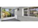 Charming home exterior with a screened-in porch and well-maintained landscaping for curb appeal at 9790 66Th N St # 469, Pinellas Park, FL 33782
