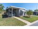 Exterior front of home with simple landscaping and sidewalk at 9790 66Th N St # 469, Pinellas Park, FL 33782