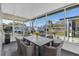 Cozy screened-in lanai with a table and chairs, perfect for enjoying the outdoors in comfort and style at 9790 66Th N St # 469, Pinellas Park, FL 33782