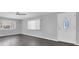 Bright and airy living room featuring contemporary flooring, fresh paint, and natural light at 9790 66Th N St # 469, Pinellas Park, FL 33782