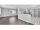 Open-concept living and kitchen area with wood floors and stylish black and white flooring at 9790 66Th N St # 469, Pinellas Park, FL 33782