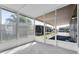 Enclosed patio area with concrete floor and views of neighboring homes and mature landscaping at 9790 66Th N St # 469, Pinellas Park, FL 33782