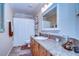 Bathroom with granite countertops, stylish vanity, and shower with white curtain at 10130 Paddock Oaks Dr, Riverview, FL 33569