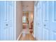 Hallway with linen closets leading to main bathroom at 10130 Paddock Oaks Dr, Riverview, FL 33569