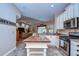 Bright kitchen with white cabinets, stainless steel appliances, and an island with butcher block countertop at 10130 Paddock Oaks Dr, Riverview, FL 33569