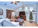 Bright living room with fireplace and vaulted ceiling at 10130 Paddock Oaks Dr, Riverview, FL 33569
