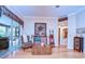 Comfortable living room with sliding glass doors and tasteful decor, creating a welcoming ambiance at 10130 Paddock Oaks Dr, Riverview, FL 33569
