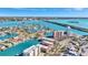 A great aerial view of waterfront condominiums, city, canals, and beautiful Tampa Bay at 113 Island Way # 241, Clearwater Beach, FL 33767