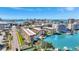 Aerial view of condos, docks, pool, city streets and clear skies at 113 Island Way # 241, Clearwater Beach, FL 33767