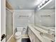 This bathroom features a tiled shower and floor with a blue wall color at 113 Island Way # 241, Clearwater Beach, FL 33767