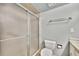 This bathroom features a tiled shower and toilet with a blue wall color at 113 Island Way # 241, Clearwater Beach, FL 33767