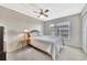 This bedroom has a ceiling fan and view of the buildings across the street at 113 Island Way # 241, Clearwater Beach, FL 33767