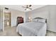 This bedroom has a ceiling fan, dresser, and view to the hallway at 113 Island Way # 241, Clearwater Beach, FL 33767