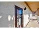 Exterior hallway with painted walls, lighting, and door with window screen at 113 Island Way # 241, Clearwater Beach, FL 33767