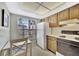 Efficient kitchen features a cozy dining area and natural light at 113 Island Way # 241, Clearwater Beach, FL 33767