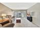 Cozy living room with carpet flooring, comfortable furniture, and balcony access at 113 Island Way # 241, Clearwater Beach, FL 33767
