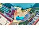 Aerial shot of the community pool, hot tub, shuffleboard court, dock and outdoor lounge area at 113 Island Way # 241, Clearwater Beach, FL 33767