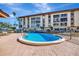 Outdoor swimming pool with brick pavers in a well maintained community at 113 Island Way # 241, Clearwater Beach, FL 33767