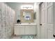 Bright bathroom with white vanity and framed mirror over sink, and shower-tub combination at 11539 Captiva Kay Dr, Riverview, FL 33569
