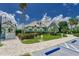Exterior of the community clubhouse with lush landscaping and parking at 11539 Captiva Kay Dr, Riverview, FL 33569