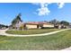 Well-maintained home with a lush lawn, beautiful landscaping, and a convenient two-car garage at 11539 Captiva Kay Dr, Riverview, FL 33569