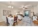 Open concept living and dining area with modern furnishings and ample natural light at 11539 Captiva Kay Dr, Riverview, FL 33569