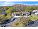 Overhead view of complex featuring mature trees, landscaping and designated parking at 12135 Environmental Dr # 2, New Port Richey, FL 34654